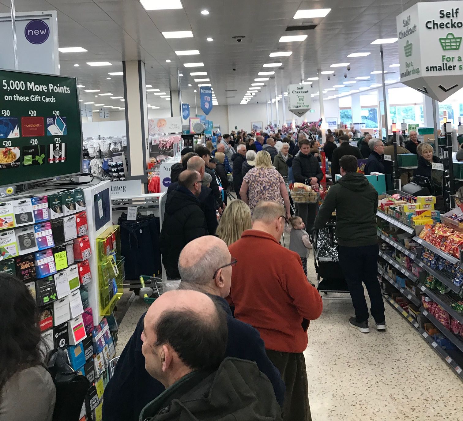 Shoppers queue at the tills at the Morrisons supermarket on Lord Street in Southport. Photo by Andrew Brown Media