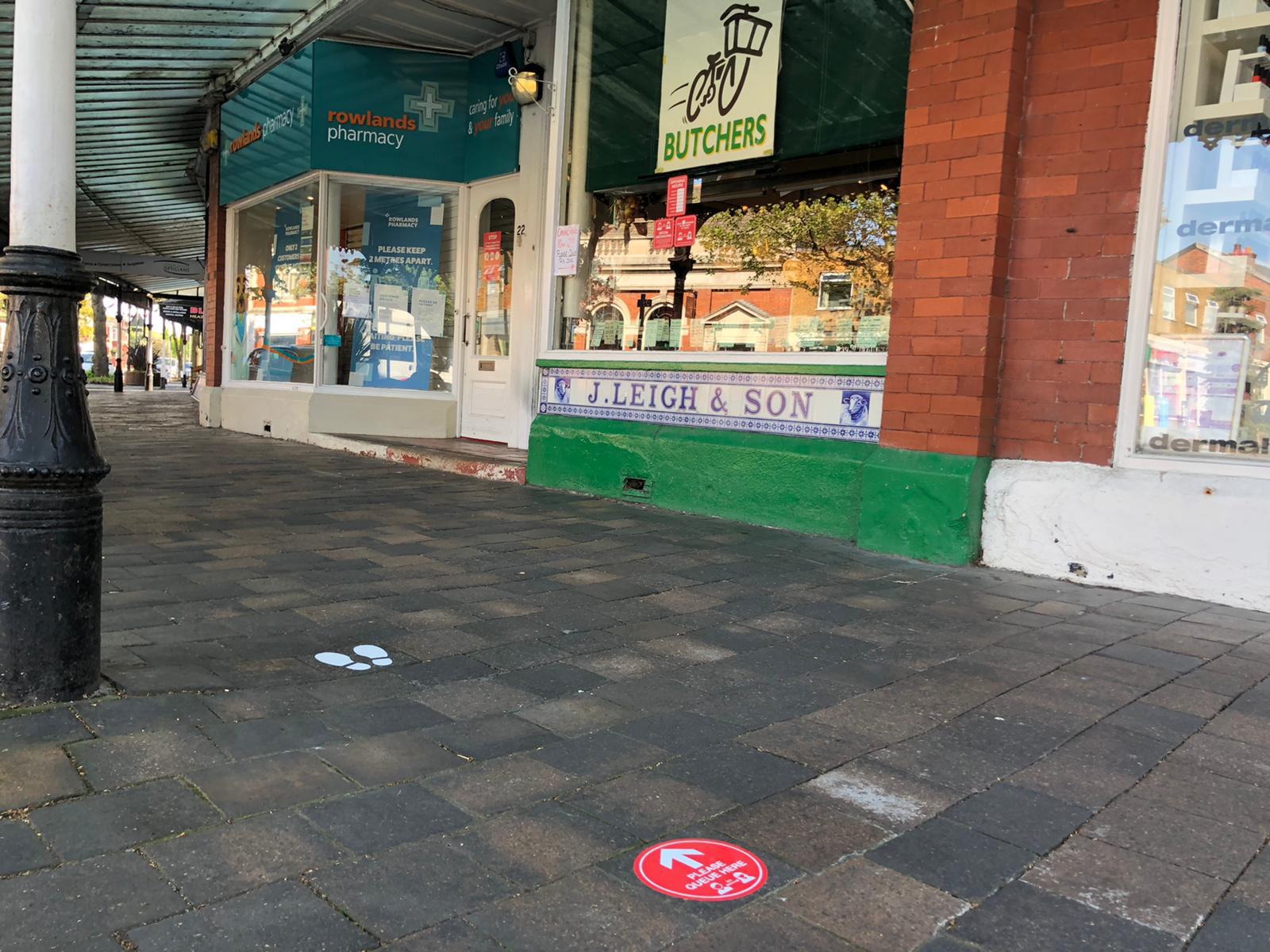 New social distancing signs created by Southport firm Magnetic Activation outside Broughs butchers in Birkdale in Southport