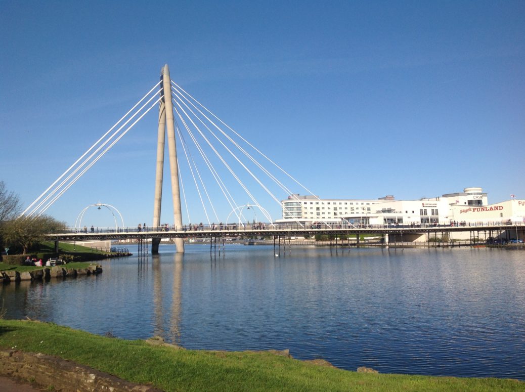 The Marine Lake in Southport, with the Marine Way Bridge, Southport Pier, Bliss Hotel and Kings Gardens.