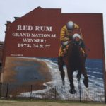 Liverpool mural artist Paul Curtis and the huge Red Rum artwork in Southport