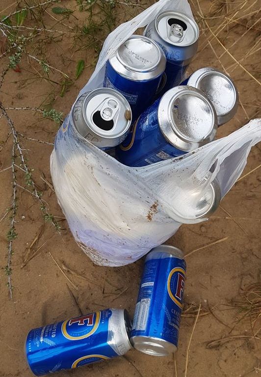 Cans of Fosters discarded in the sand dunes in Southport. Photo by Jonathan Cunningham