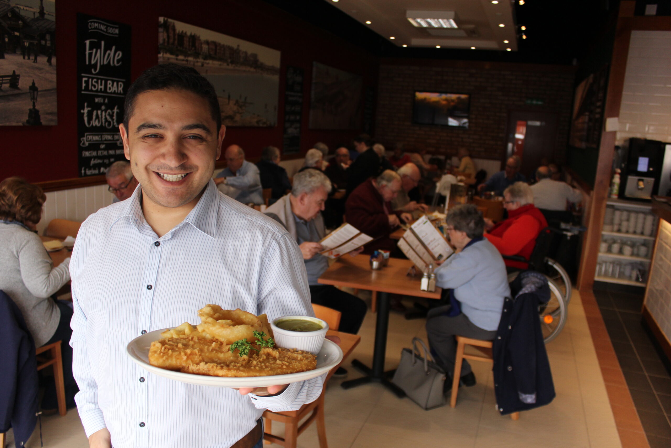 Changes have been made to the award winning Fylde Fish Bar fish and chip shops in Southport and Burscough to make them safer for diners. Owner Banico Zeniou pictured in the Fylde Fish Bar in Marshside, Southport, before the coronavirus lockdown came into force.