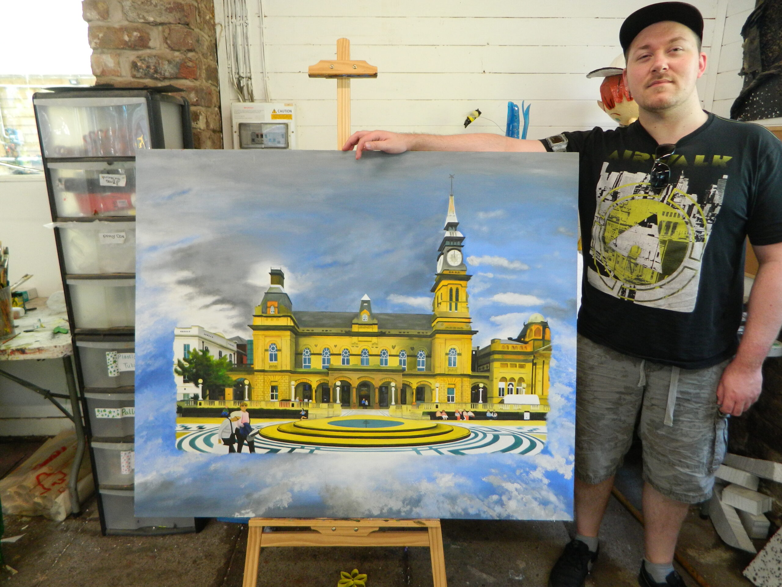 Kyle McNamara with his painting of The Atkinson in Southport