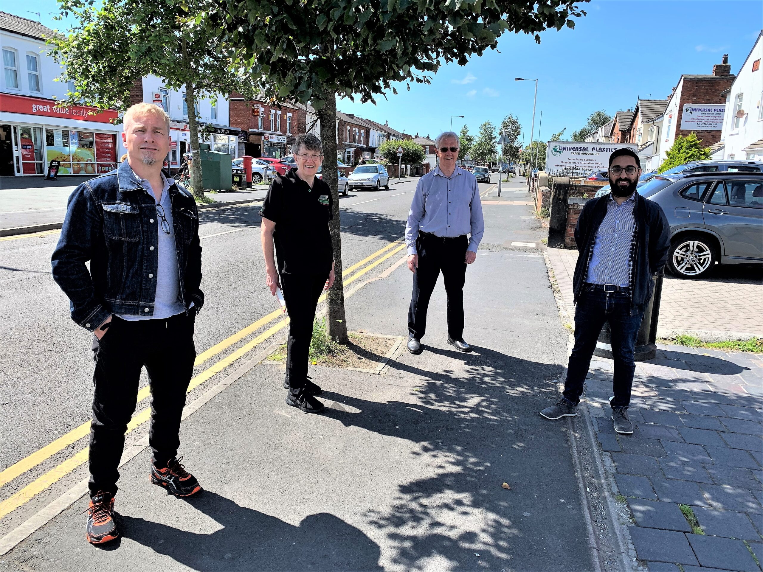 Cllr Greg Myers (on left) with local business people Anne Molyneux of Gymphobics, postmaster David Hartley and pharmacist Bharat Bajaj