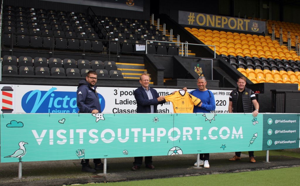 Peter Hampson from Visit Southport is pictured with Southport FC Head Of Operations, James Tedford, Manager Liam Watson and Commercial Manager Steve Brown as the unveiling of the new Visit Southport board at the Pure Stadium