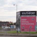 The social distancing coronavirus / Covid-19 sign board on Preston New Road in Crossens in Southport