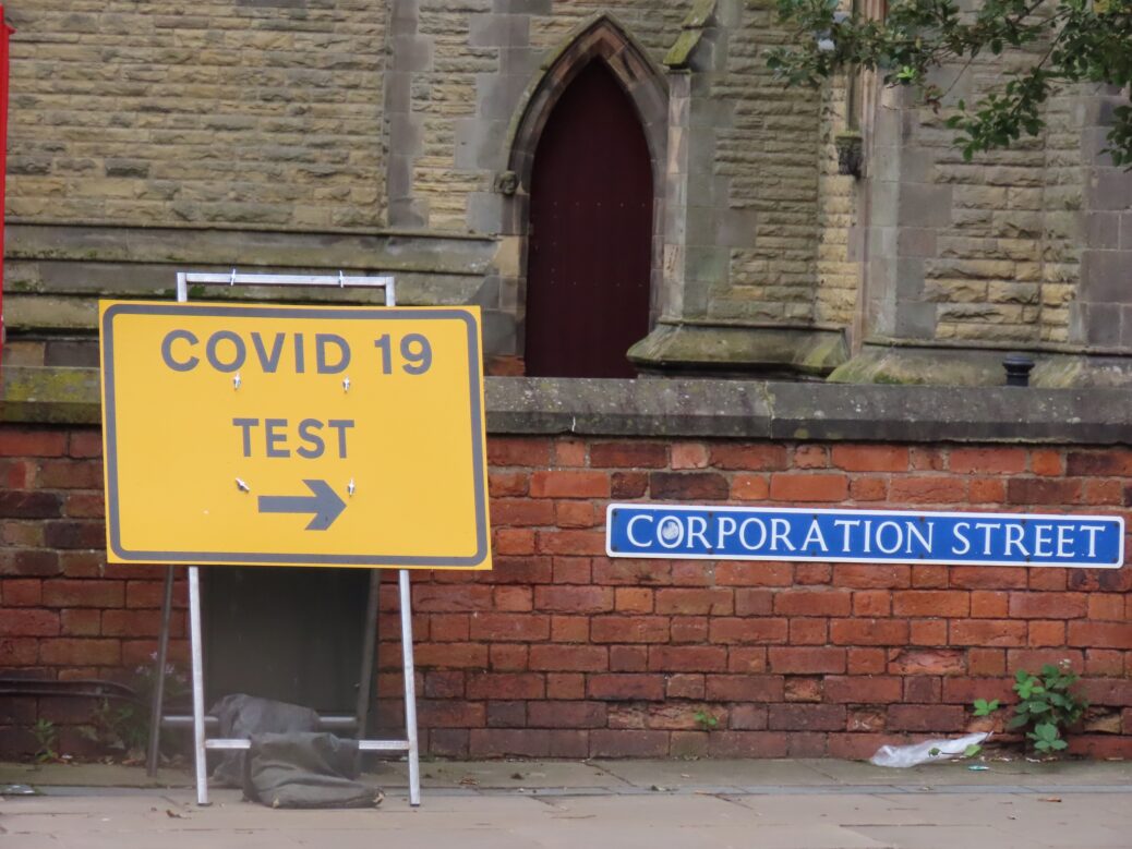 A sign posting towards the Covid-19 / coronavirus testing site on Corporation Street in Southport