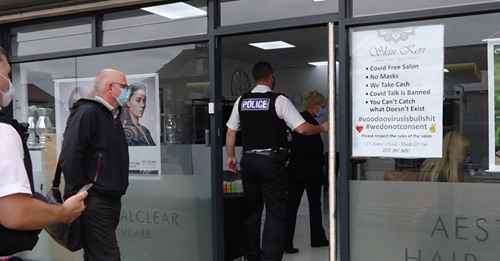 Merseyside Police officers visit the Skin Kerr beauty salon in Bootle after owners display a poster in the window denying the existence of Covid-19