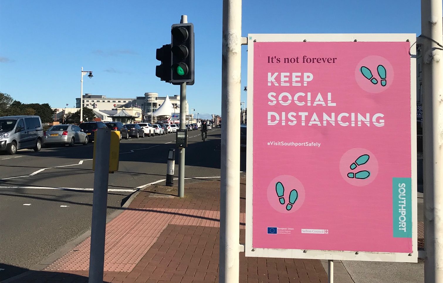 A Covid-19 / Coronavirus warning sign on the Promenade in Southport. Photo by Andrew Brown Media