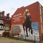 A huge mural of legendary racehorse Red Rum by acclaimed street artist Paul Curtis was unveiled in Southport in March