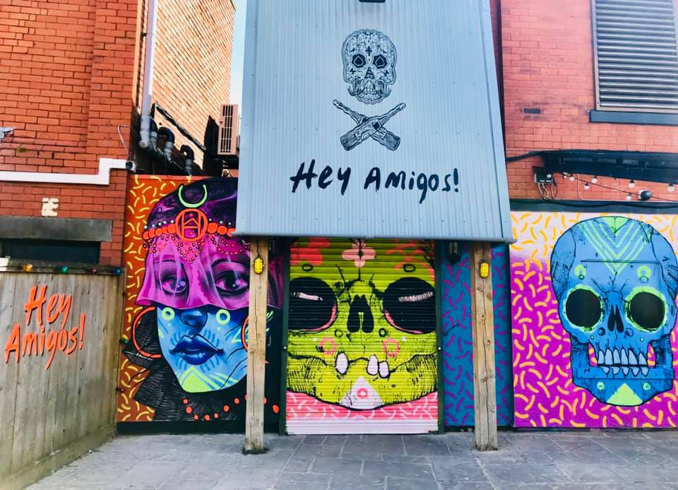 Mexican themed street art outside Hey Amigos bar on West Street in Southport 
