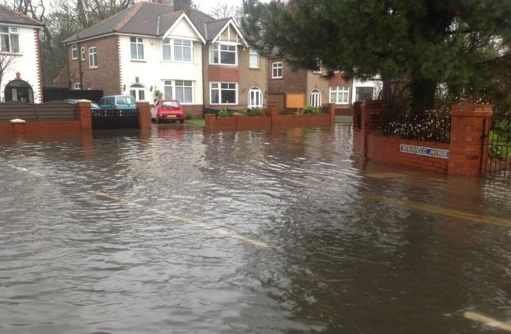A flooded Merlewood Avenue in Churchtown in Southport. Photo by Andrew Brown Media
