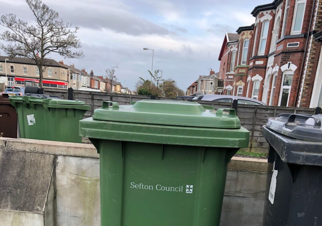 A green wheelie bin for garden waste recycling by Sefton Council