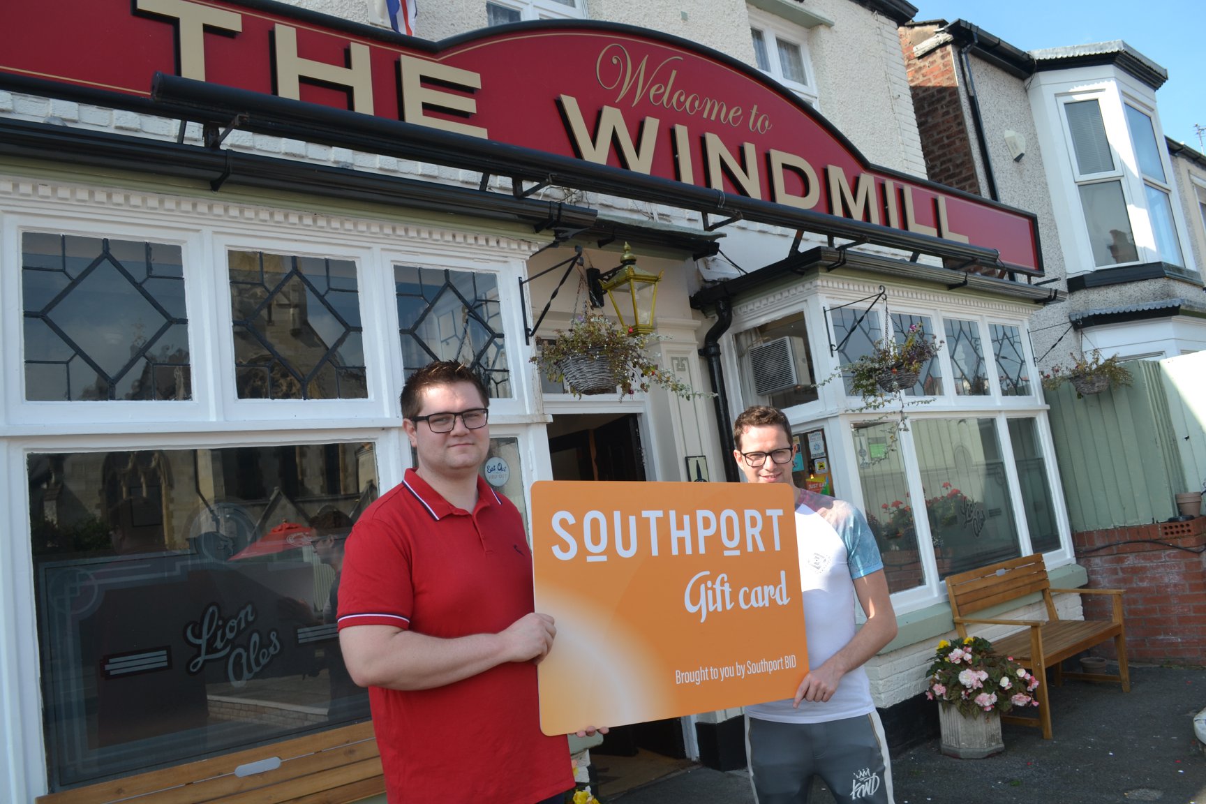 Neil Walsh and partner Tom Hodgin at The Windmill pub on Seabank Road in Southport with the Southport Gift card