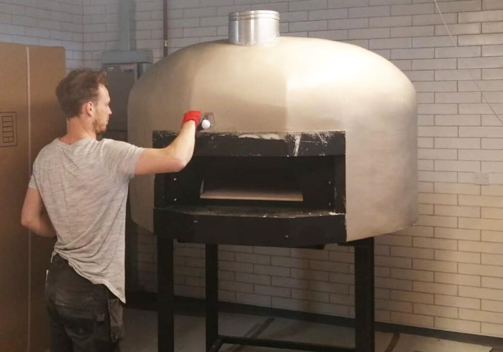 600 Degrees is building a new pizza oven, ready for when they move into their new unit in Southport Market