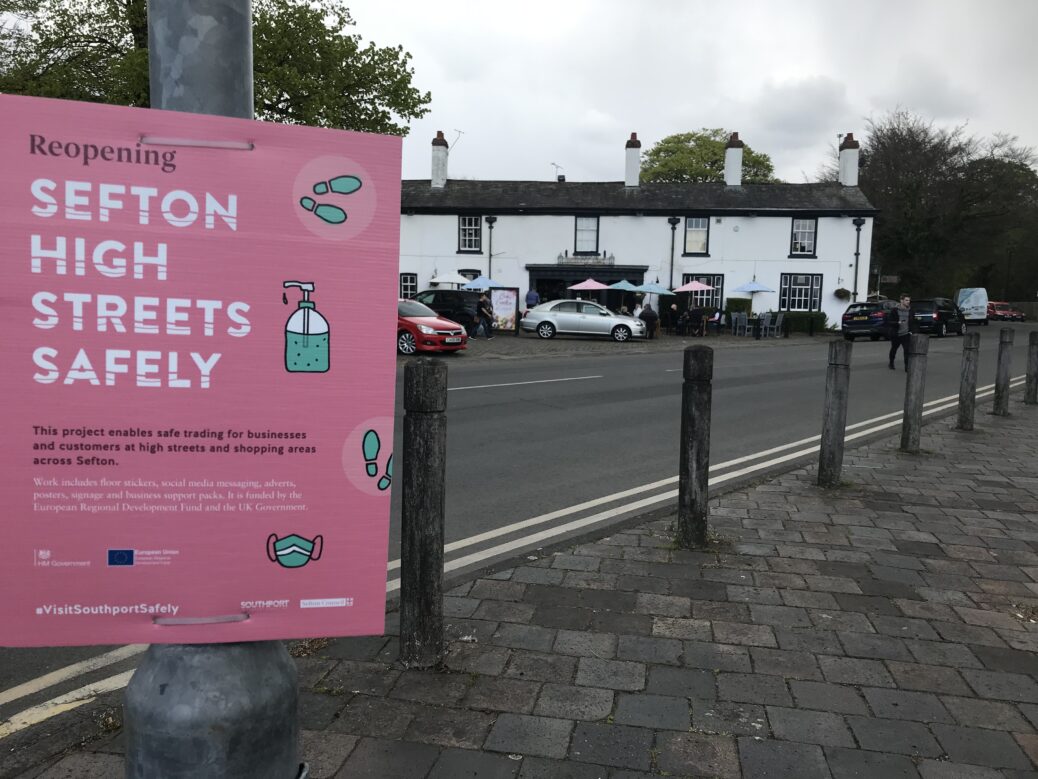 A Covid poster in Churchtown Village in Southport. Photo by Andrew Brown Media