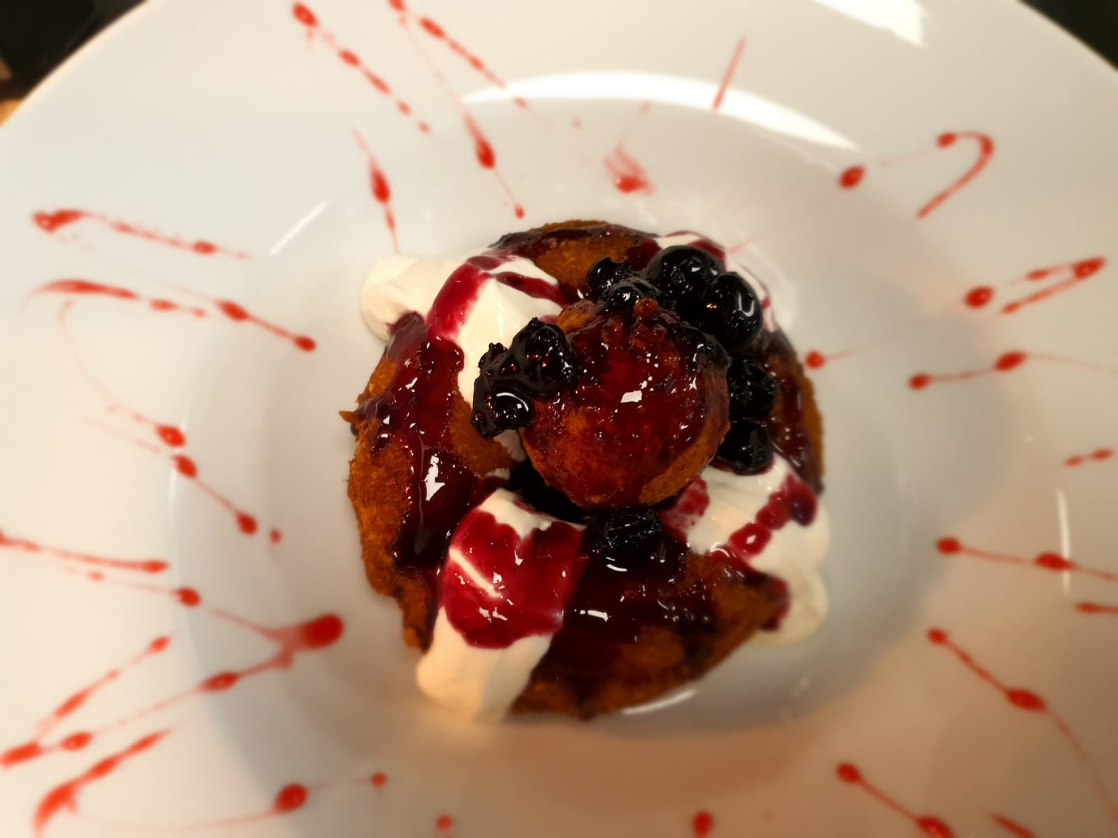 A dessert at Grill Hunters on Lord Street in Southport. Doughnut with sour cream and cherries