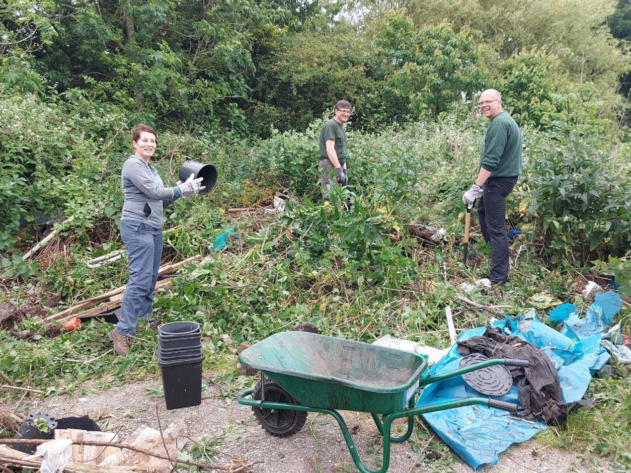 Volunteers clean up an allotment in Crosby. Photo by Sefton Council
