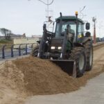 Southport tractor sand clearance in action