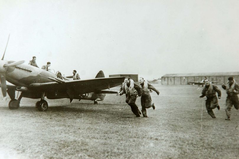 Pilots scramble for their Spitfires at RAF Woodvale