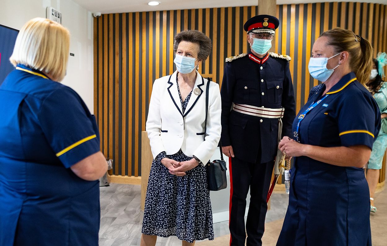 HRH The Princess Royal tours and formally opens the newly built mental health facility at Hartley Hospital , accompanied by Mersey Care NHS Trust Chairman Beatrice Fraenkel and Chief Executive Prof Joe Rafferty CBE as they meet clinicians and service users . Photo credit : Joel Goodman