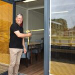 Southport FC Manager Liam Watson cuts the ribbon to formally open the Fanzone ahead of the game against Gloucester City