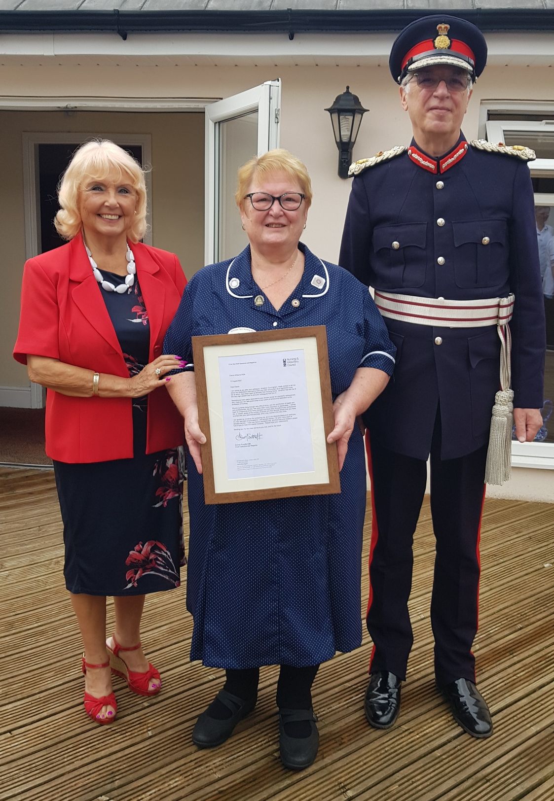 Elaine Williams RGN with Mark Blundell the Merseyside Lord Lieutenant with owner Carol Cunningham at Birkdale Park Nursing Home in Southport