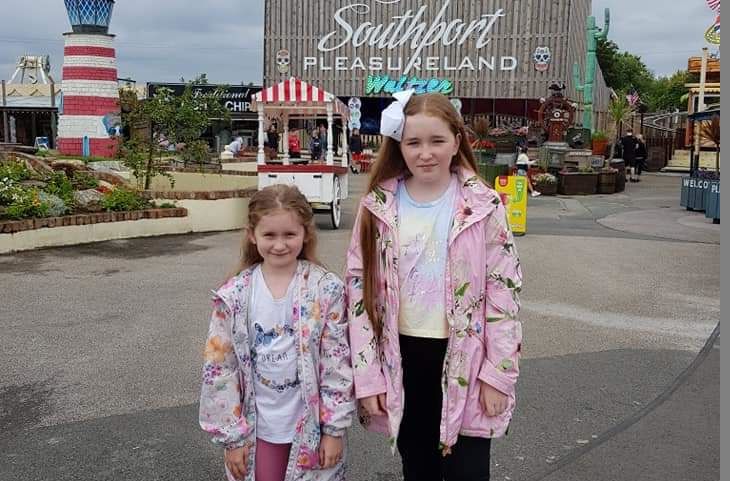 Lexie, left with her cousin Ellie at their favourite amusement park, Southport Pleasureland. Ellie will also be doing the run