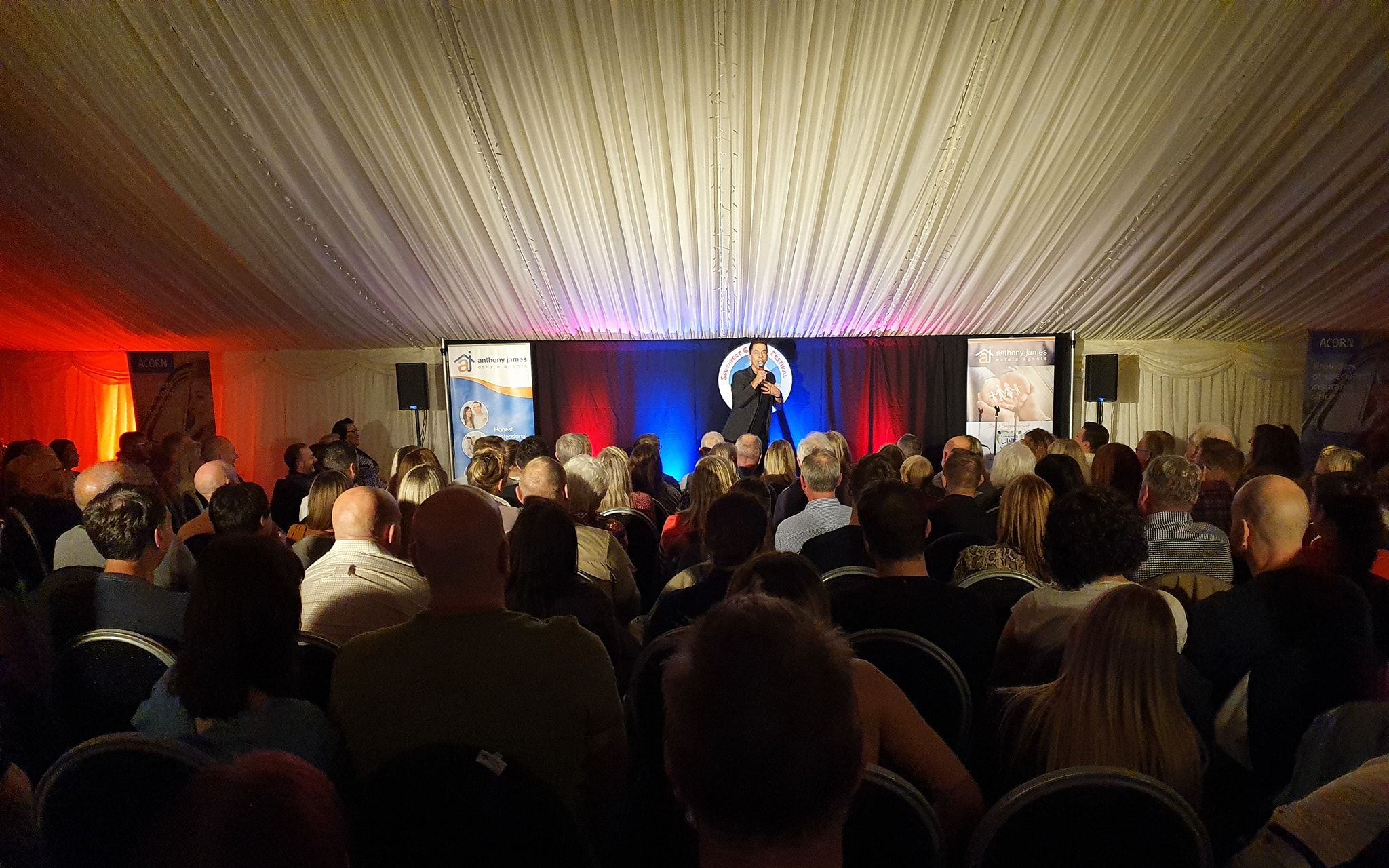 Russel Kane performs at Southport Comedy Festival in a marquee provided by Elite Marquees