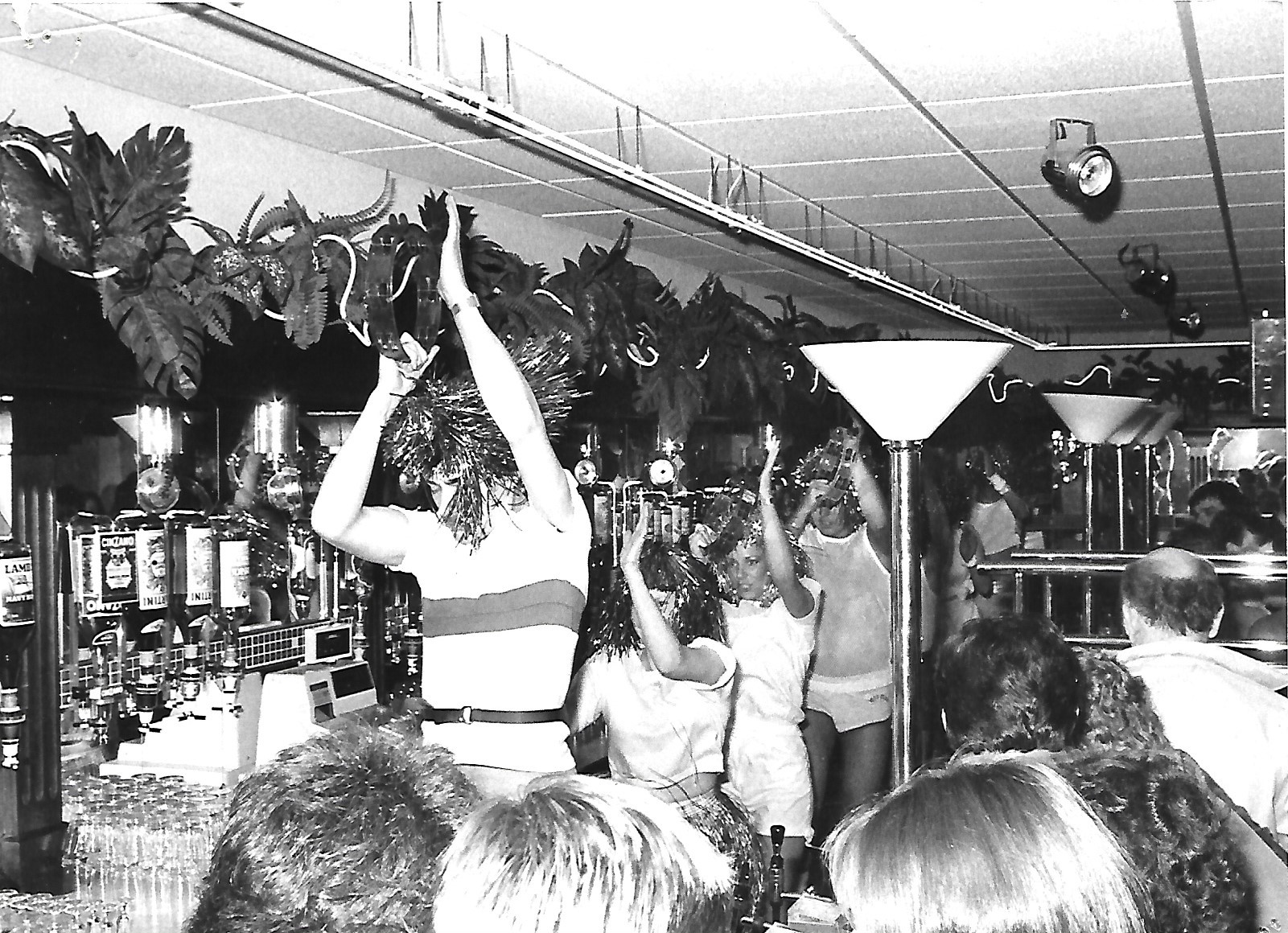 Lots of fancy dress on display at The Pavilion fun pub (later the Fox & Goose) bar in Southport in May 1984