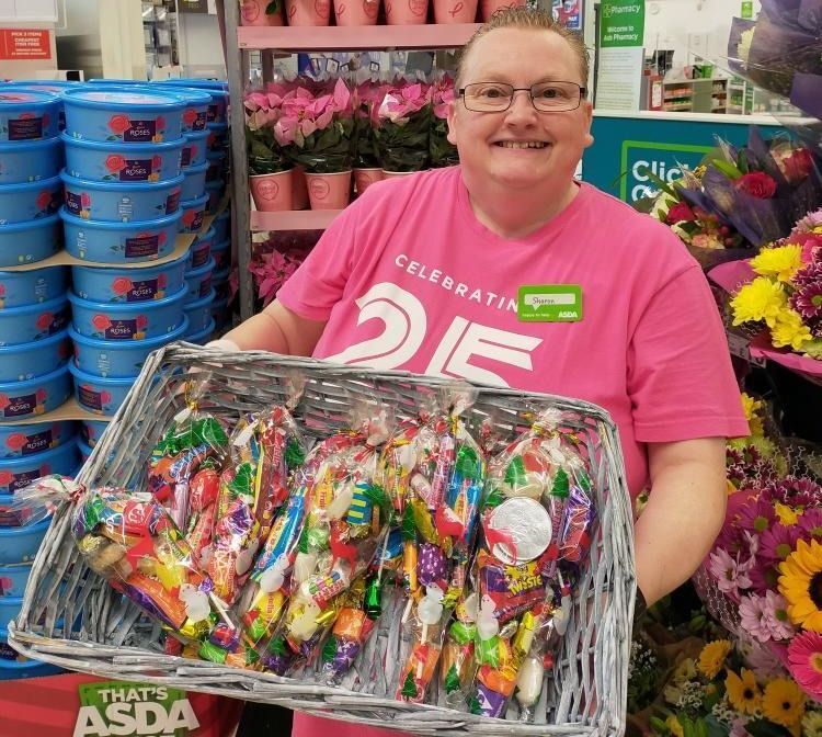 Southport ASDA supermarket community champion Sharon Gregory-Wareing has raised around £1,000 by making sweet boxes and cones and selling them to colleagues and customers for the Tickled Pink breast cancer appeal