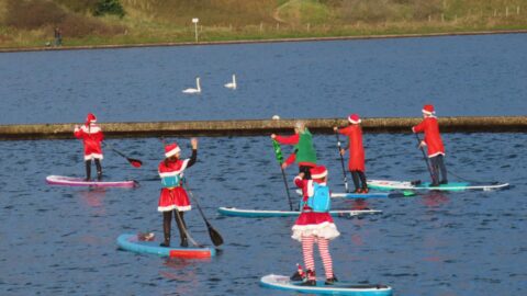 Paddle boarding Santas prepare to support Queenscourt Hospice at Southport Santa Sprint