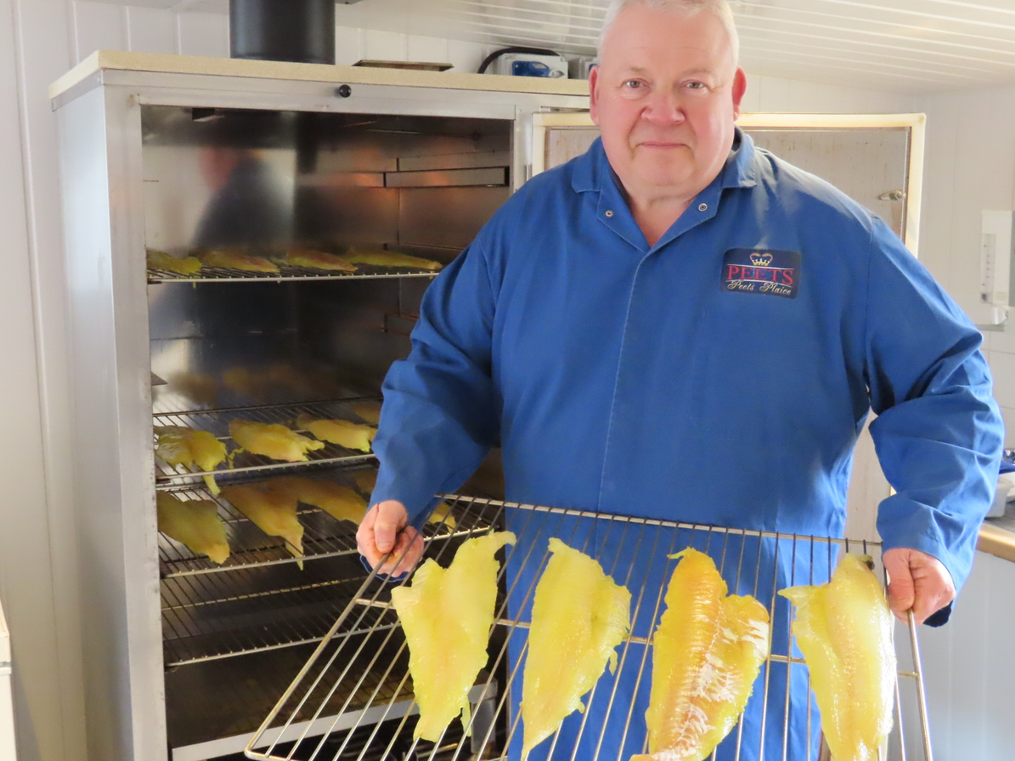 Kevin Peet, owner of Peets Plaice in Churchtown in Southport, with his smoker and his home smoked fish. Photo by Andrew Brown Media