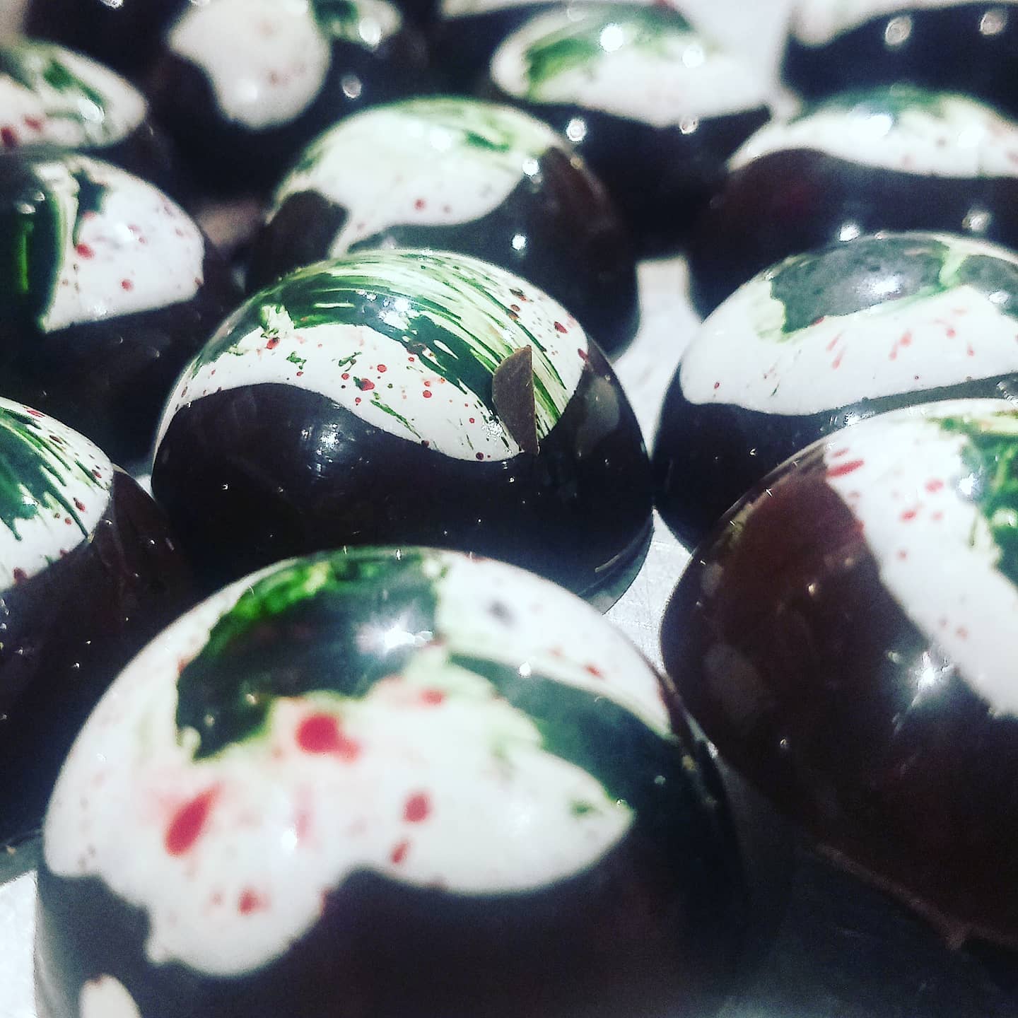 This year's Botanic Road Fine Chocolate dome shaped Christmas Pudding Truffles - filled with ganache made from soaked raisins, rum, spices, cream and milk chocolate. Outer shell in dark chocolate