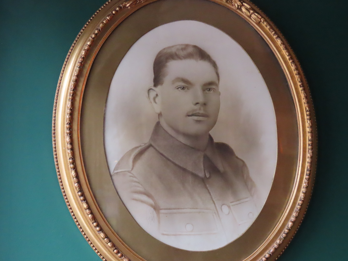 People are being asked to help solve a mystery about a soldier who served in World War One whose picture hangs on the wall of Kokomo Coffee & Wine Bar on Bold Street in Southport. Photo by Andrew Brown Media