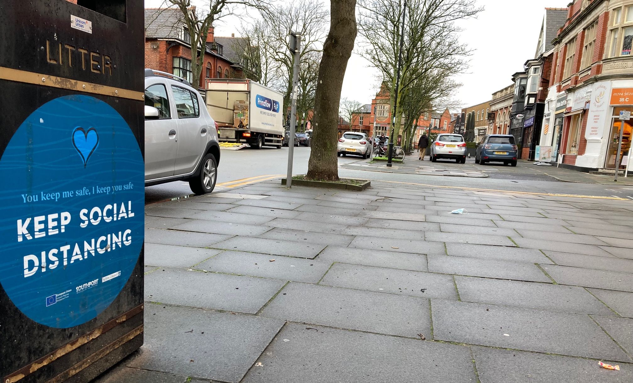 A Covid-19 social distancing sign in Birkdale Village in Southport. Photo by Andrew Brown Media