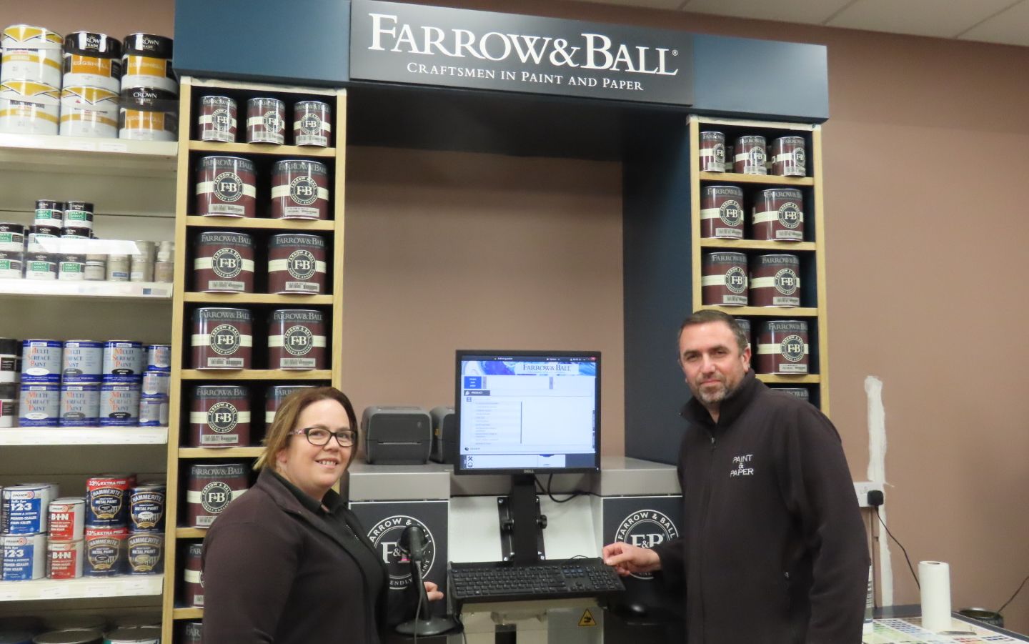 Steve Dunbavin and Lisa Pennington with the Farrow & Ball paint mixing machine at Paint n Paper in Birkdale in Southport. Photo by Andrew Brown Media