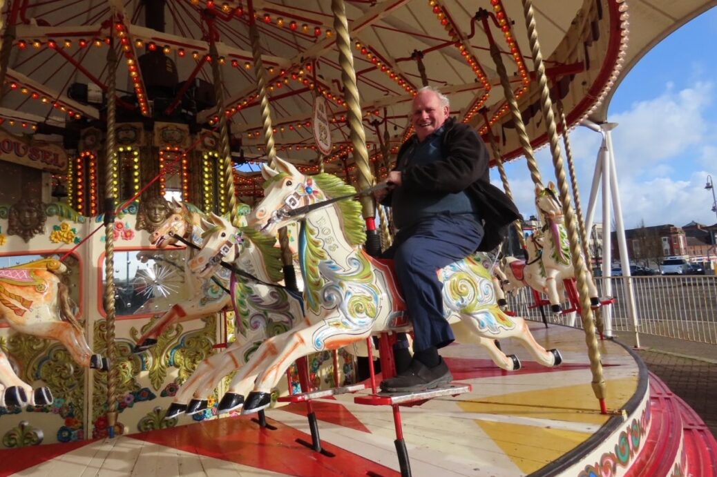Michael Ross on a house at Herbert Silcock's Carousel in Southport. Michael has worked with the family for nearly 60 years. Photo by Andrew Brown Media