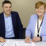 Principal Michelle Brabner signing the charter, alongside AOC Mental Health Lead Richard Caulfield