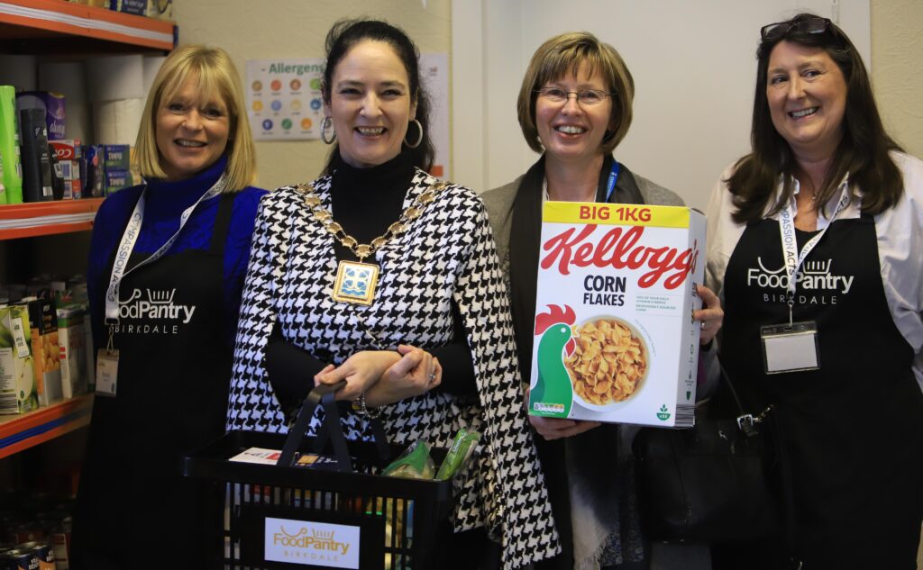 Mayor of Sefton Cllr Clare Louise Carragher (second left) at the opening of the new Birkdape Pantry in Southport, along with three Compassion Acts volunteers. Photo by Matt Dodd
