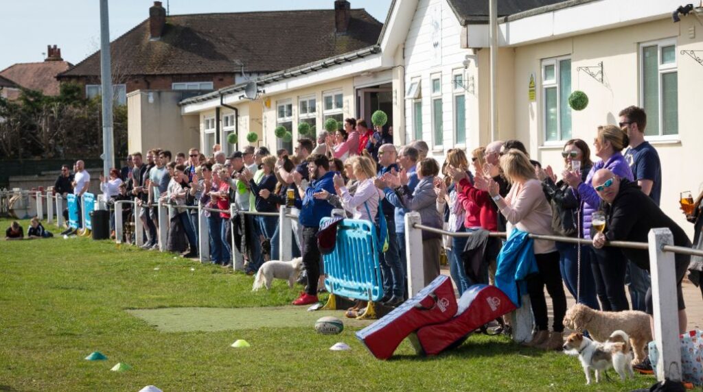 Crowds watch a game at Southport Rugby Football Club. Photo by Angus Matheson of Wainwright & Matheson Photography