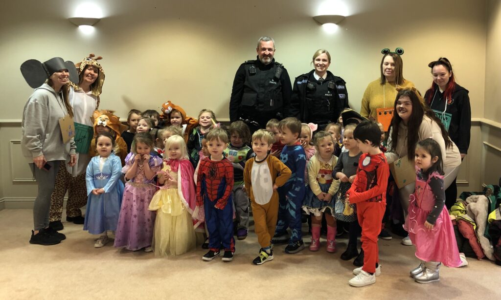 Children and staff from Monkey Puzzle Nursery with Merseyside Police Officers Dave Jackson and Laura Rowling, having enjoyed World Book Day with Southport College students at Wayfarers Arcade