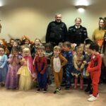 Children and staff from Monkey Puzzle Nursery with Merseyside Police Officers Dave Jackson and Laura Rowling, having enjoyed World Book Day with Southport College students at Wayfarers Arcade