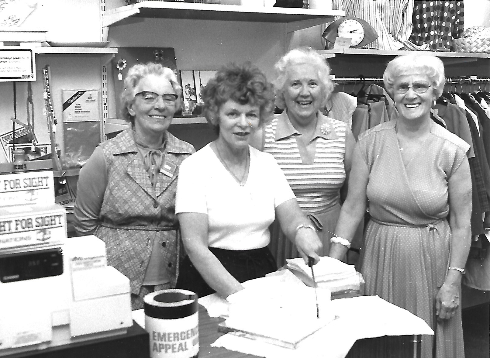Oxfam volunteers gather at the Oxfam shop in Southport in June 1983