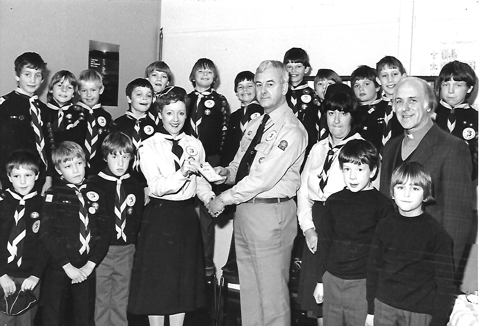 A Scout Leader is presented with her Warrant at St Peter's Cub Scouts pack in Birkdale in Southport in December 1982