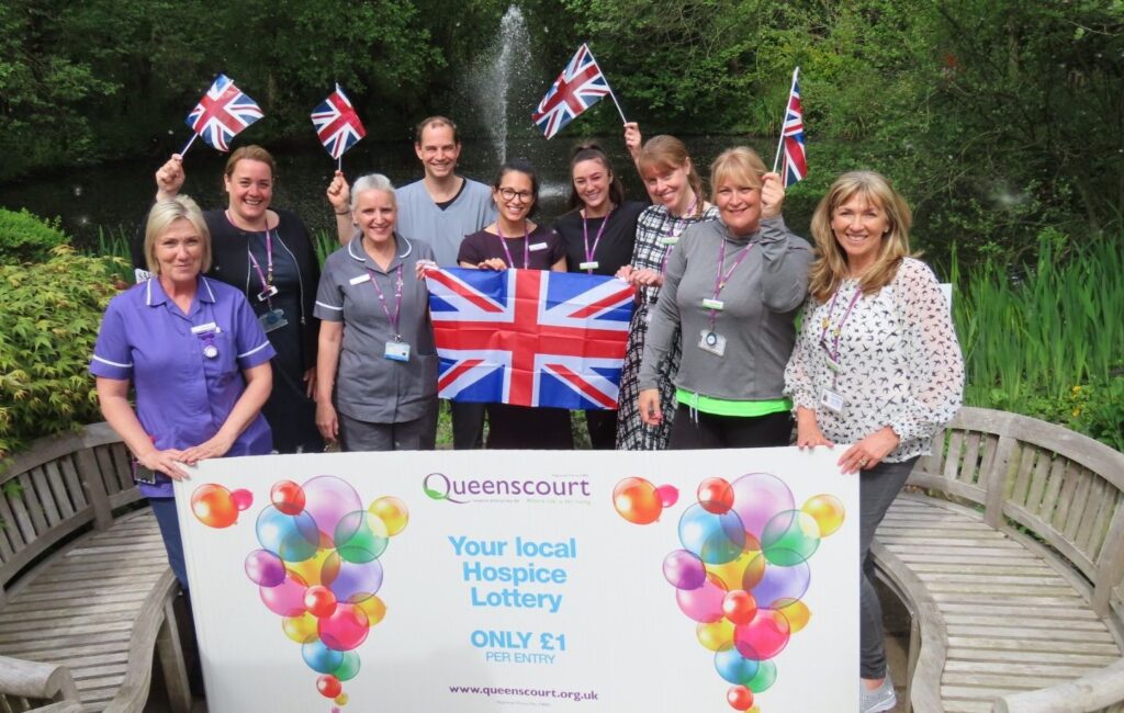 Staff at Queenscourt Hospice launch the Fly The Flag For Queenscourt campaign. Photo by Andrew Brown Media