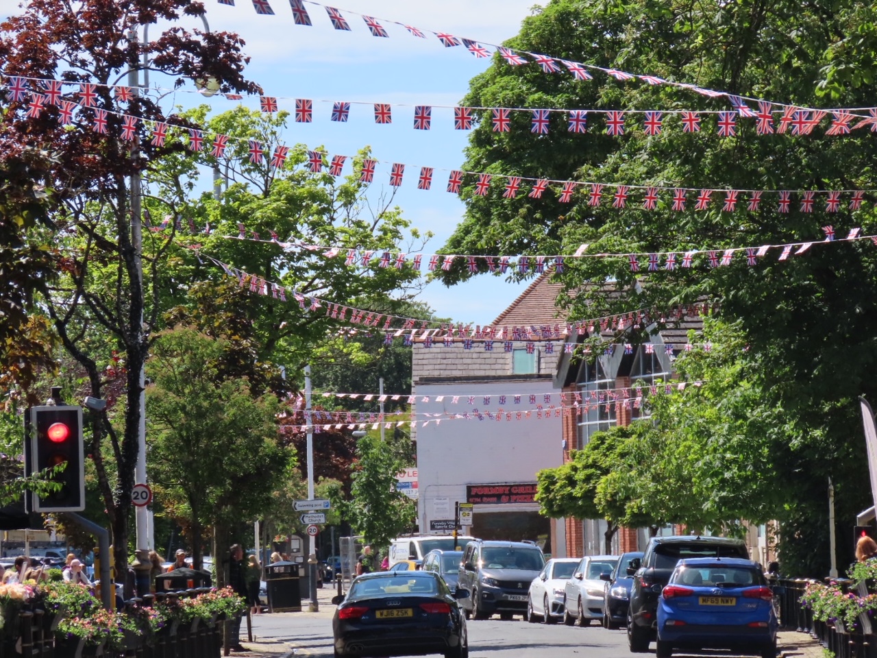Formby Village has been decorated with hundreds of metres of bunting to celebrate The Queens Platinum Jubilee by IllumiDex UK Ltd. Photo by Andrew Brown Media