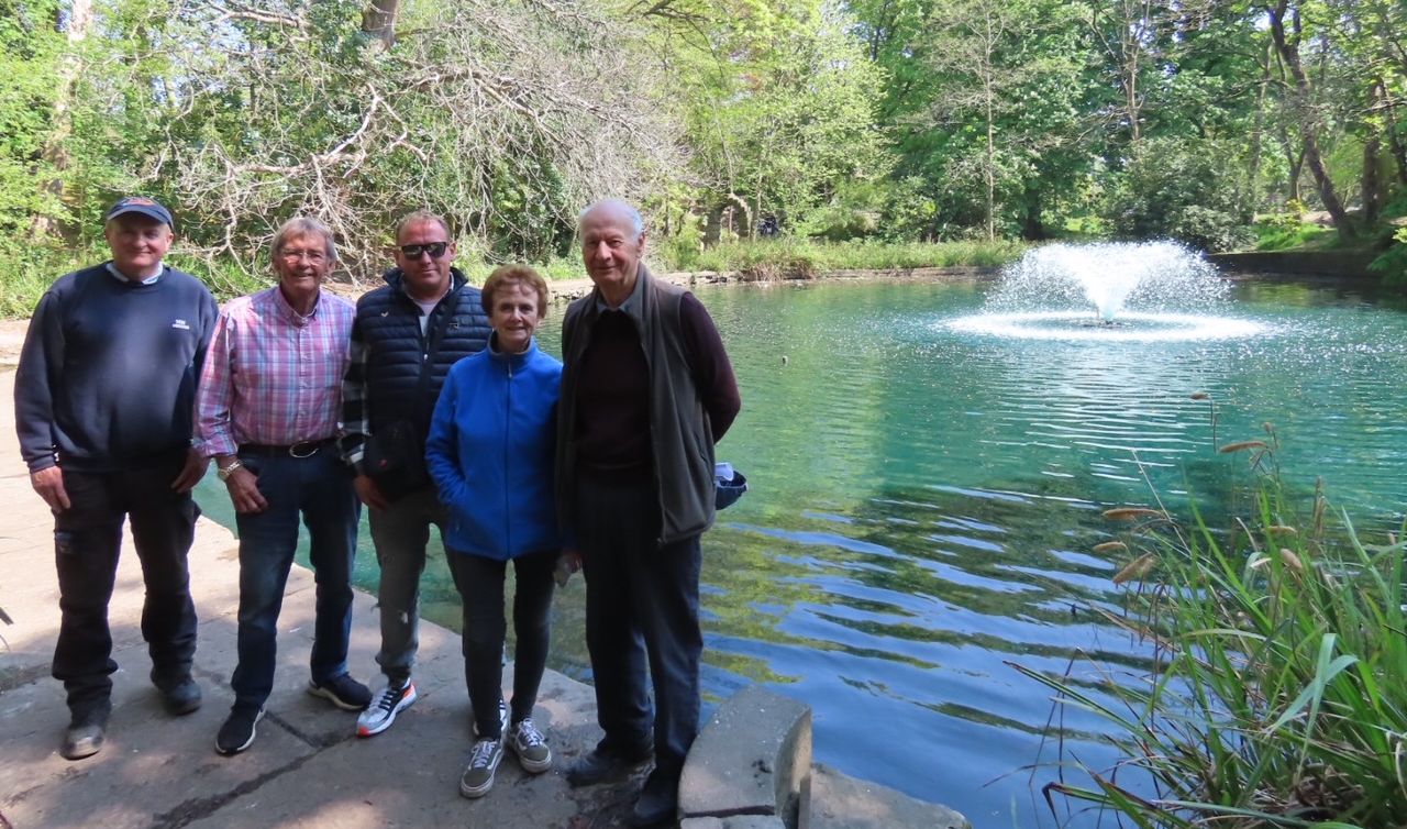 From left: Paul Sherman; Peter Smith-Crallan; David Rawsthorne; Ann Cobham; and David Cobham next to the new fountain in the lake at the Botanic Gardens in Churchtown in Southport. Photo by Andrew Brown Media