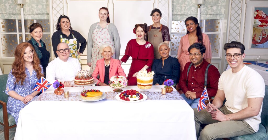 Southport contestant Jemma Melvin (back row, second left) is starring on BBC show The Jubilee Pudding - 70 Years In The Baking. Judges & Finalists with the puddings (L-R) Jane Dunn, Susan, Roger Pizey, Jemma, Kathryn, Dame Mary Berry, Regula Ysewijn, Sam, Monica Galetti, Shabnam, Dr Rahul Mandal. Photo: BBC
