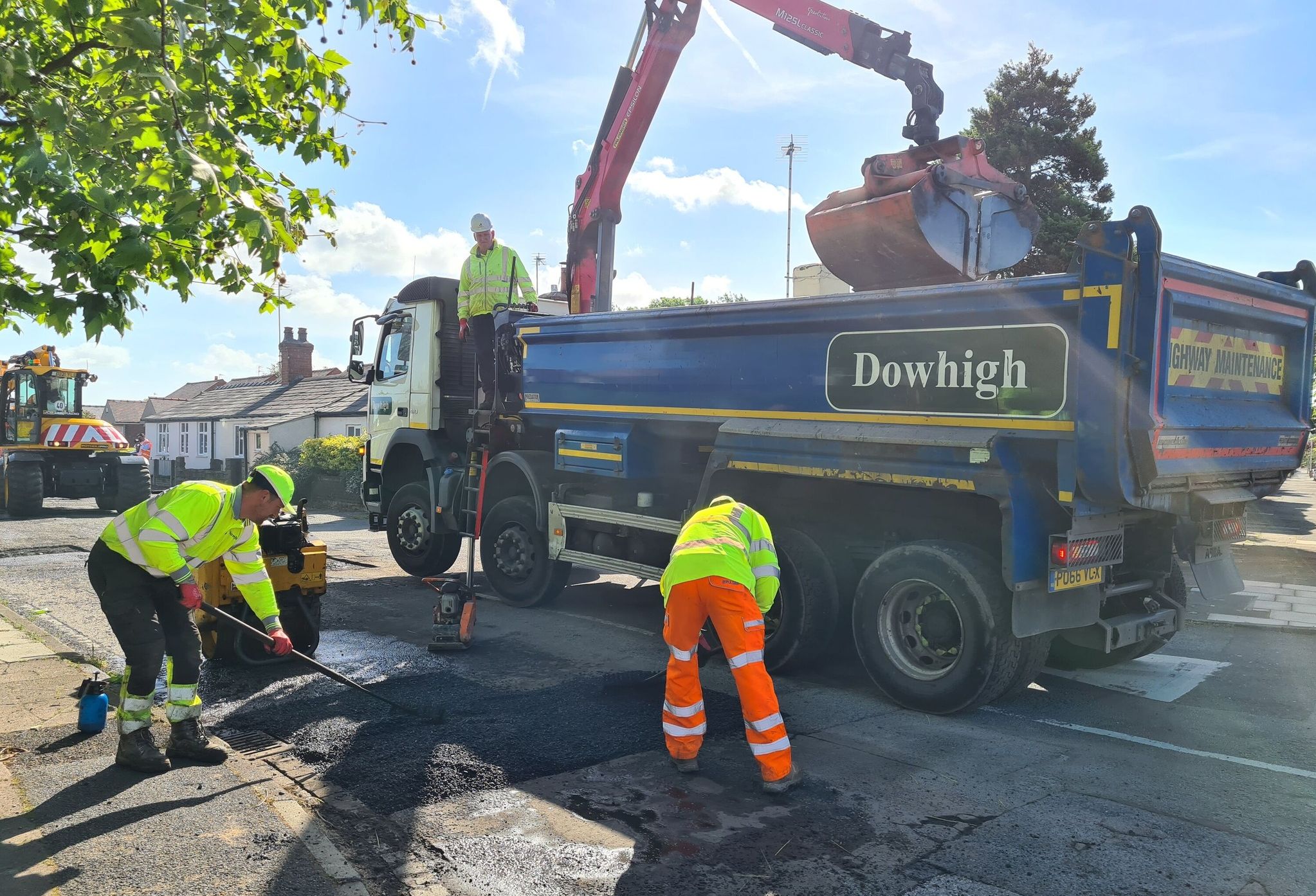 Dowhigh joined forces with the Daily Express and JCB to help the residents of Knob Hall Lane in Churchtown, which was plagued with dozens of potholes